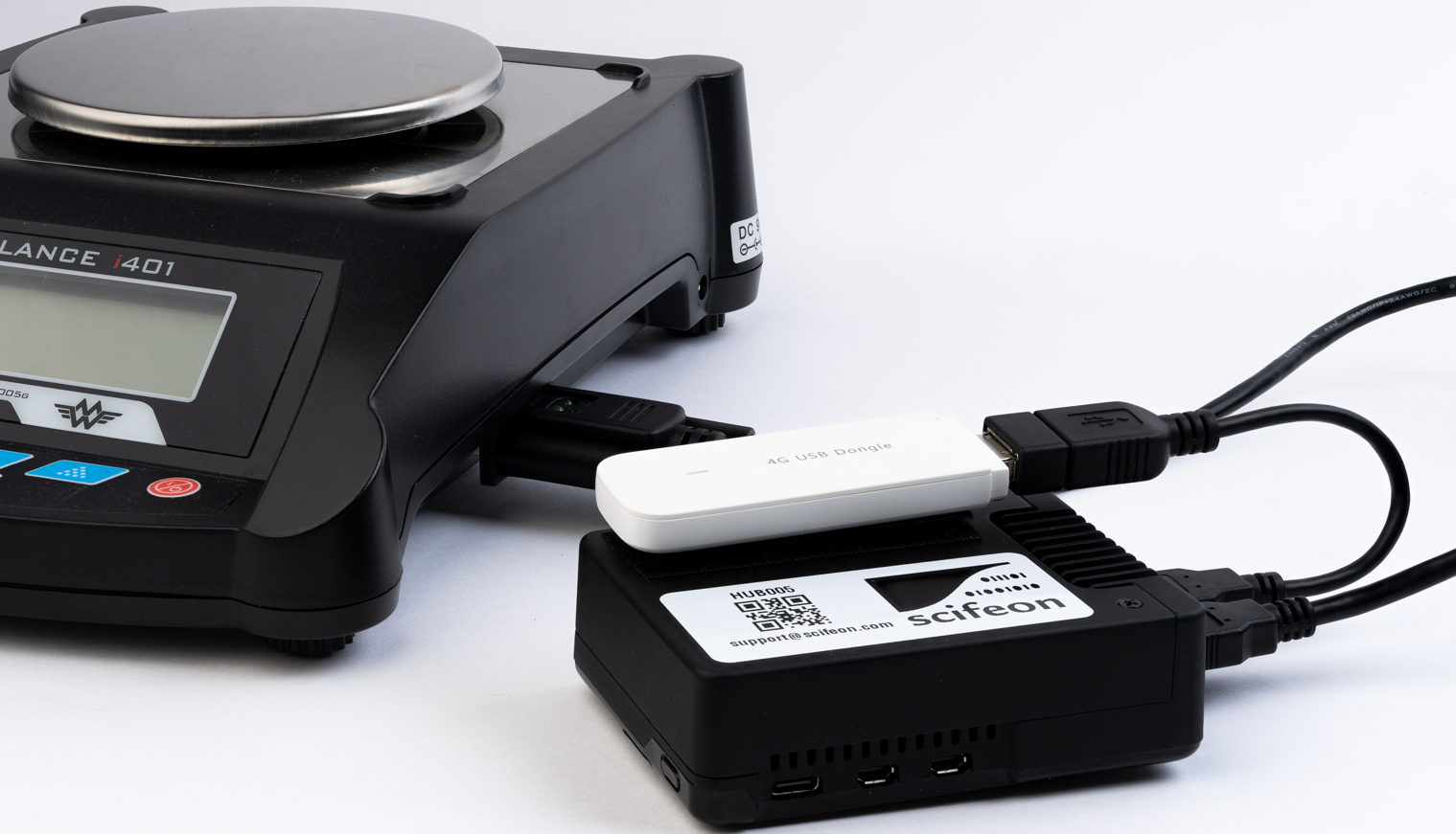 Scifeon InstrumentHub connected to a lab balance via USB, with a 4G dongle for cloud connectivity